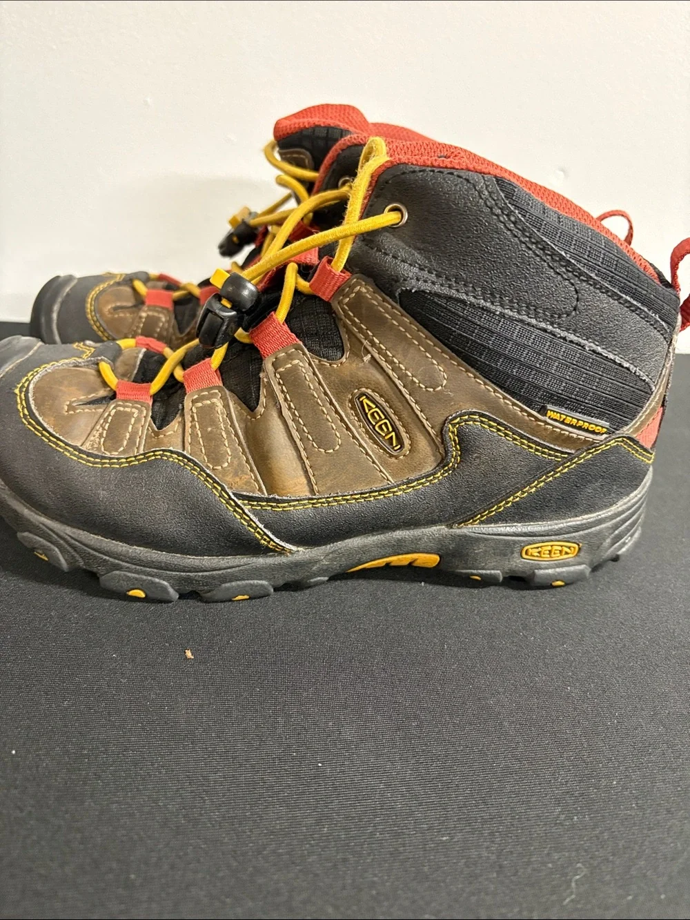KEEN Kids Brown Hiking Boots with Yellow Laces and Red Trim